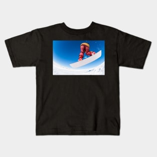 Snowboarder jumping against blue sky Kids T-Shirt